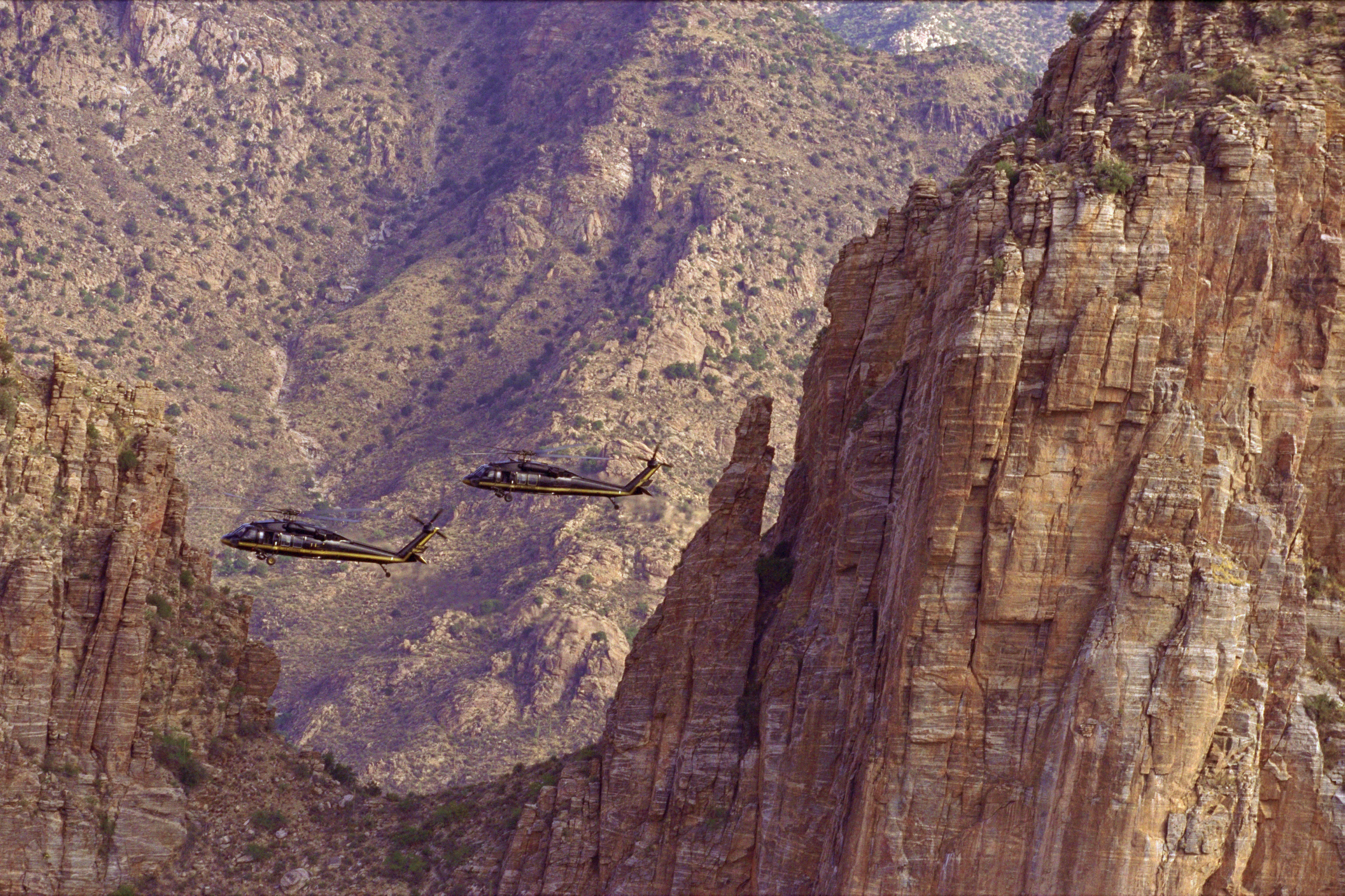 Two CBP Air unit UH-60 Black Hawk helicopters patrol the southwest border region.