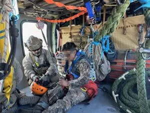 Air and Marine personnel rescue a migrant stranded in the Baboquivari mountains