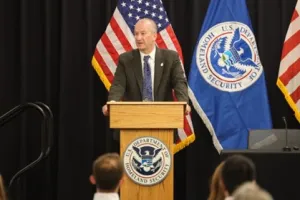 CBP Senior Official Performing the Duties of the Commissioner, Troy A. Miller at podium.