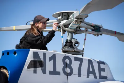 Air Interdiction Agent Astrid Gilbert does a preflight check on her helicopter.