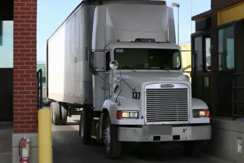 Photo of a truck going through inspection lane