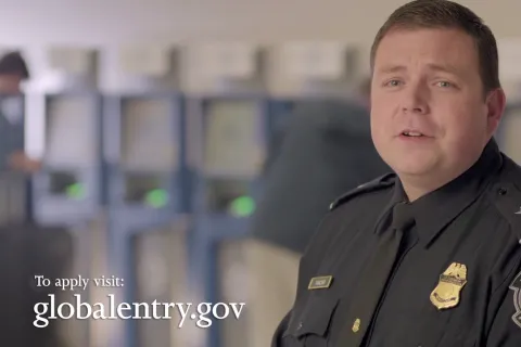 CBP officer standing inside an airport