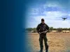 Border Patrol Agent Zach Pruett operates a small, unmanned aerial system.