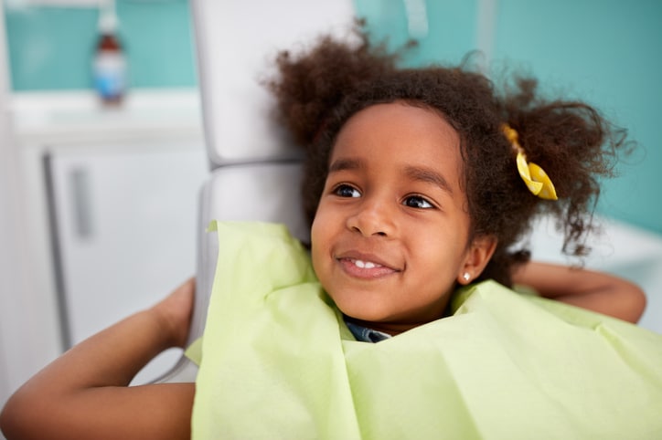 A student has his teeth examined by dentist