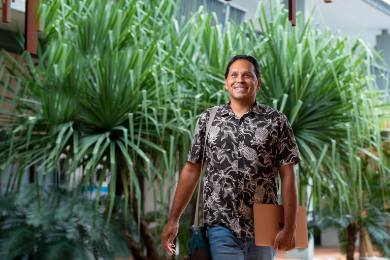 Business student Ben Tyler walking through Casuarina campus