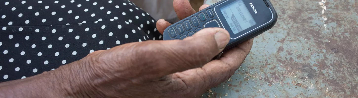 woman holding a cell phone in her hand