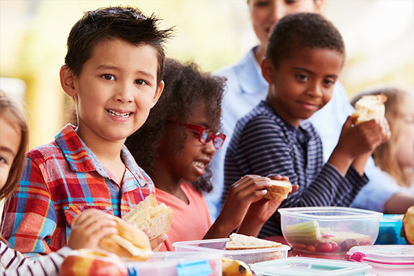 A group of children eating lunch