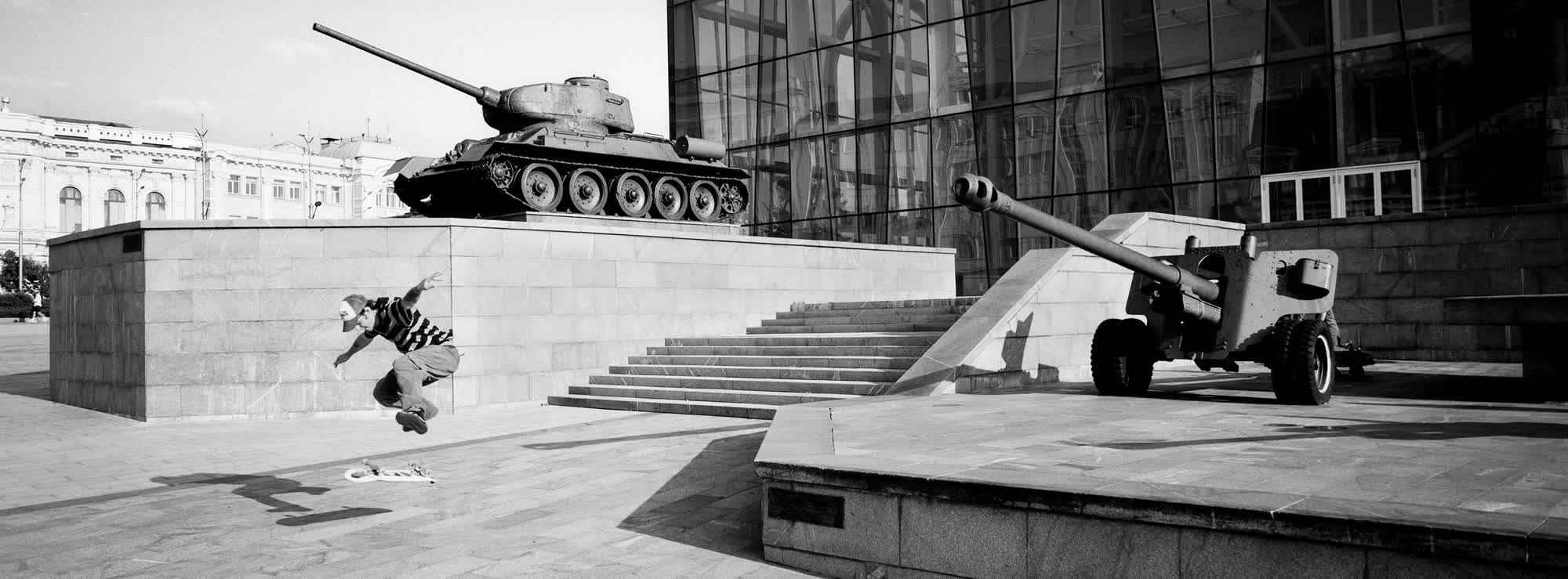 Artioum skateboards in front of the M. F. Sumtsov Kharkiv Historical Museum in Kharkiv, Ukraine.