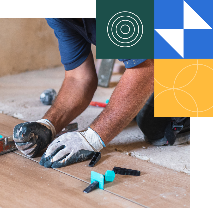 Construction worker laying out vinyl flooring