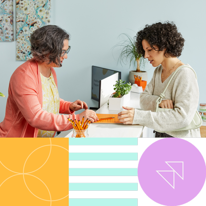 Two women going through a checklist