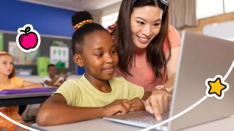 A photo of a teacher helping a student learn using a laptop computer