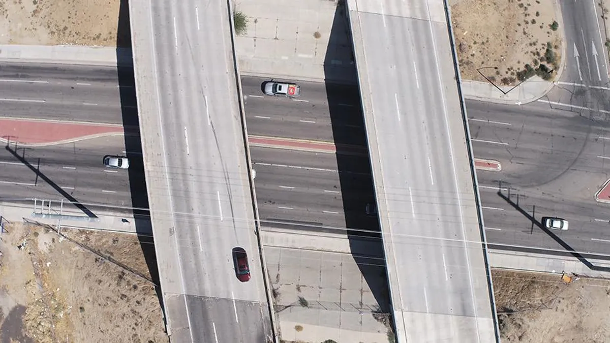 An aerial shot shows an overpass at California State Highway 14 and Avenue J in Lancaster.