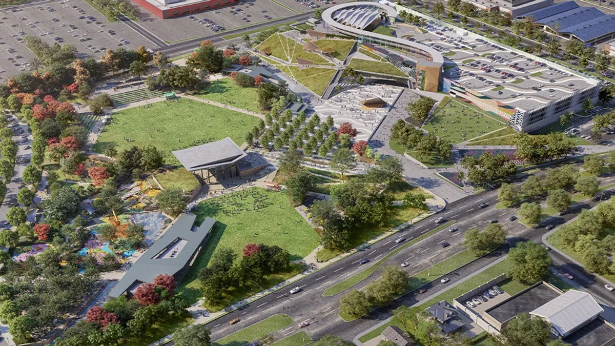 Aerial view of a sprawling park, which includes swathes of green space, a large pavillion, and a parking complex.