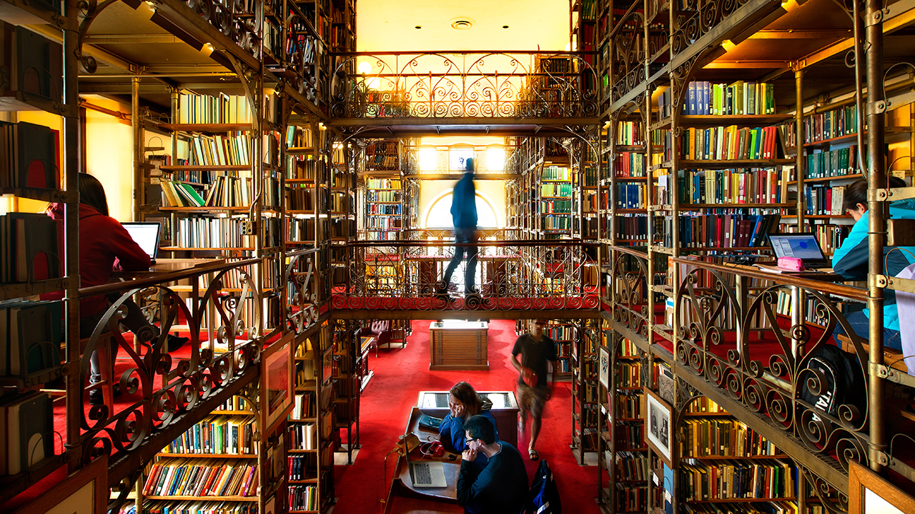 students studying in the A.D. White Library