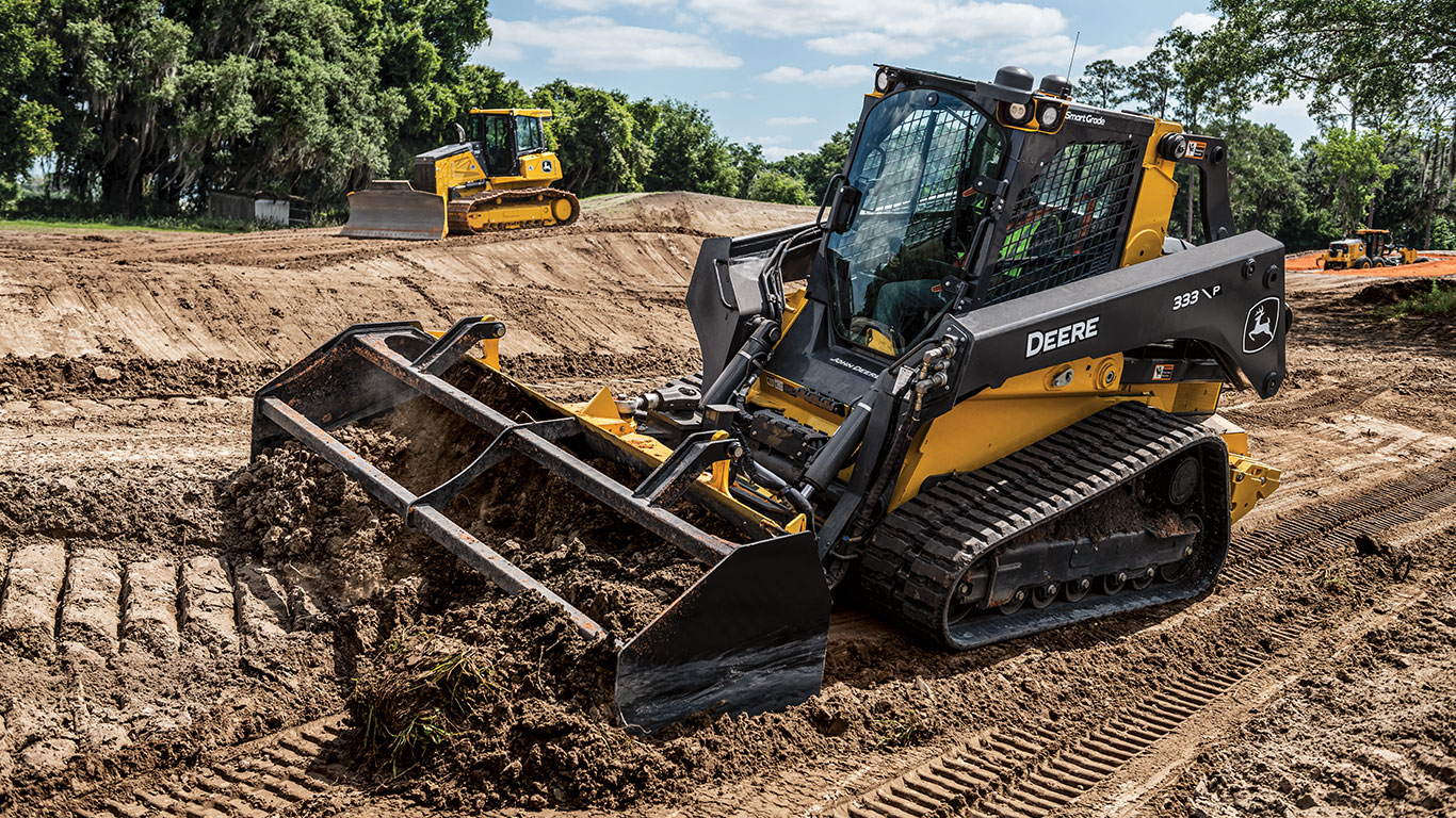 John Deere Compact Track Loader and Dozer work to grade the land