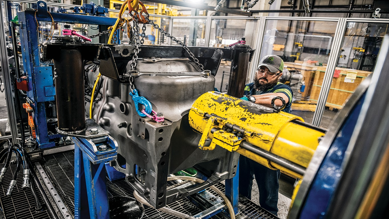 A John Deere Reman technician assembling a transmission.