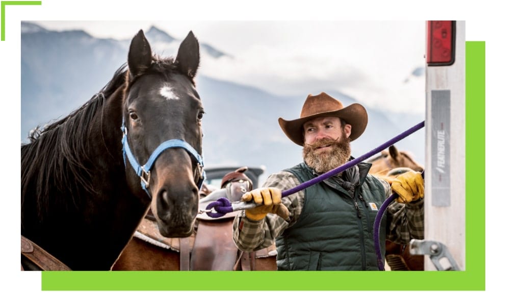 Tucker Nelson tending to his horses