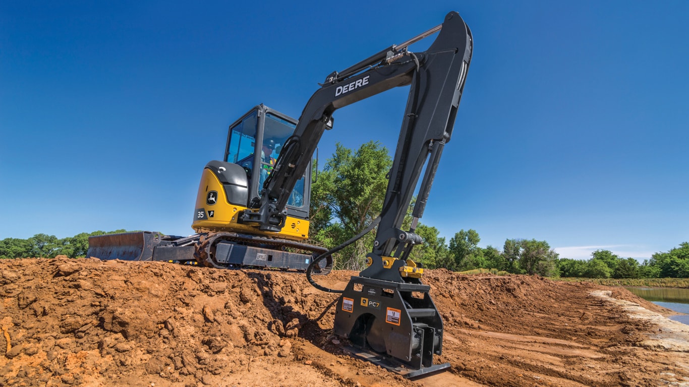 John Deere 35 P-Tier Compact Excavator with a plate compactor