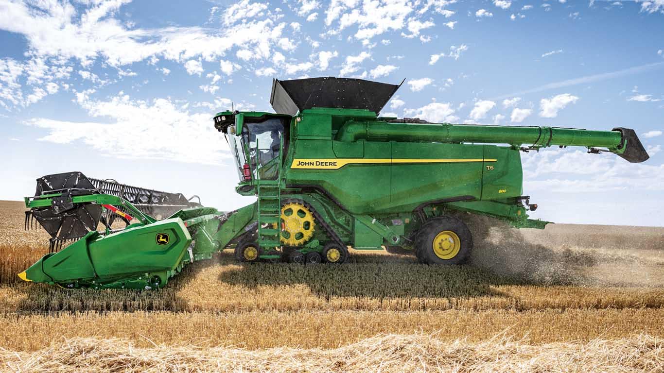 John Deere combine harvesting in small grains