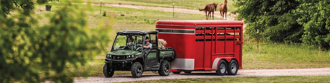 XUV 845M pulling cattle trailer