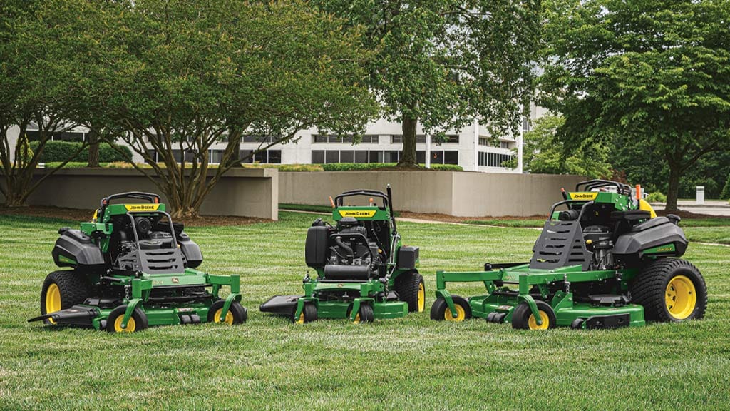 three mowers on grass