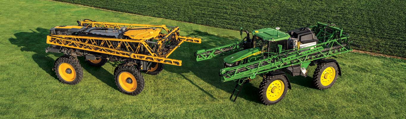 Deere & Hagie sprayers in a field