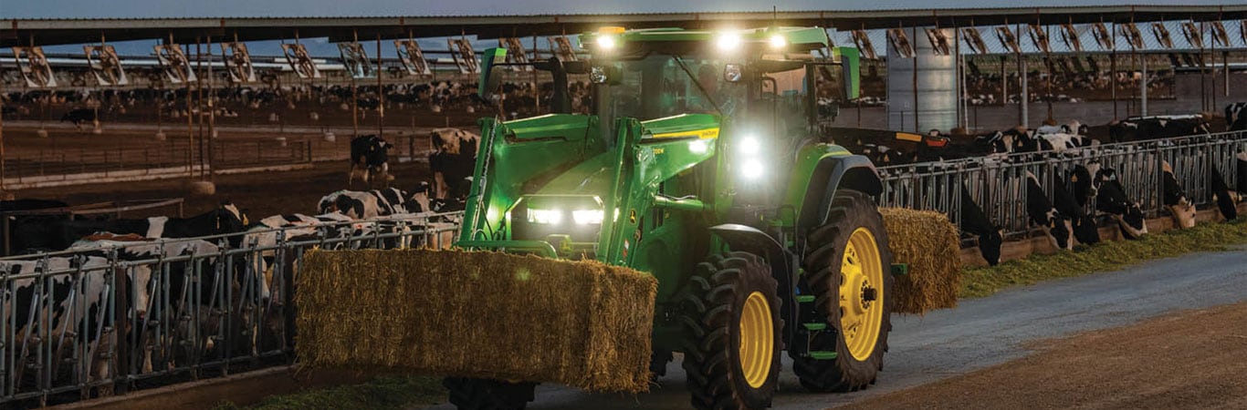 row crop tractor near barn