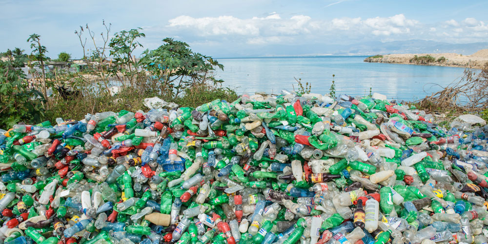 a beach covered in plastics pulled from the ocean