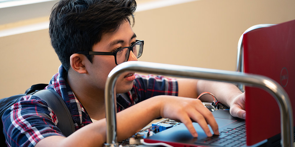 boy working on a laptop