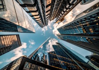 Looking skyward from street level high rise buildings.