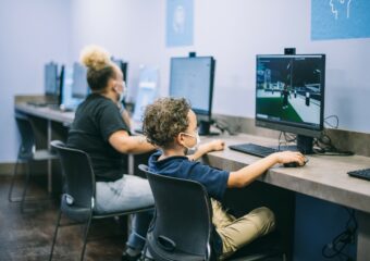 Woman and child using Dell Optiplex Ultra workstations at a new ATT Connected Learning Center