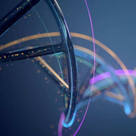 Digitally created image of DNA strands against a blue/silver background. Copper and pink colored strands appear as well as small pink and colored lights in the background.