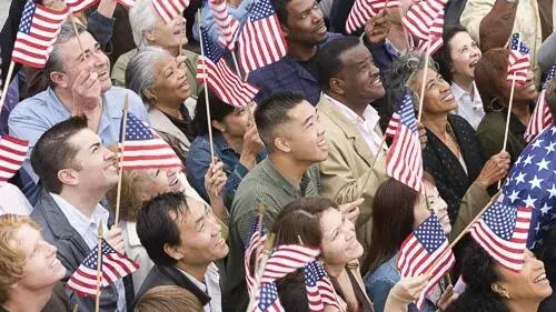 Citizens waving American flags