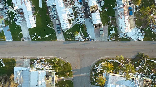 broken homes in flood ravaged community