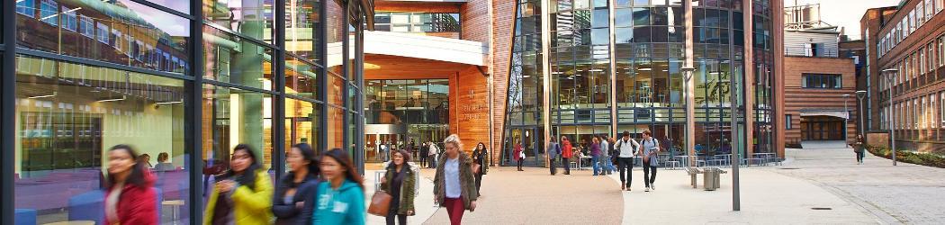 The exterior of the Palatine Centre, bustling with students between lessons