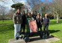 Family, friends and pro skater Chewy Cannon, with a photo of Ollie Nicholls, at the unveiling of the skateboard memorial bench in Normanston Park, Lowestoft earlier this year. Picture: The Nicholls family