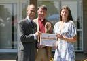 The Duke of Edinburgh presents Beatrice White with the Bishop of Norwich's Sustainable Environment Young Employee of the Year award at the Royal Norfolk Show