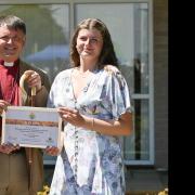 The Duke of Edinburgh presents Beatrice White with the Bishop of Norwich's Sustainable Environment Young Employee of the Year award at the Royal Norfolk Show