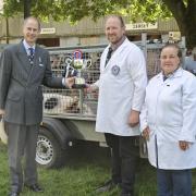 Malcolm and Sue Hicks with the Royal Norfolk Show's supreme inter-breed champion pig, a Large White gilt named Poplarburn Champion Lady 23, receiving the trophy from the Duke of Edinburgh