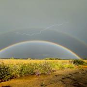 A rare double rainbow lightning has been captured over Norfolk