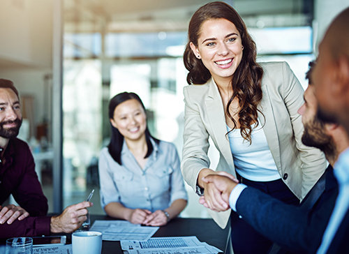 Woman shaking hands with collegue