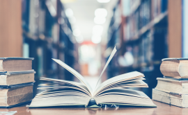 Open book with library in background