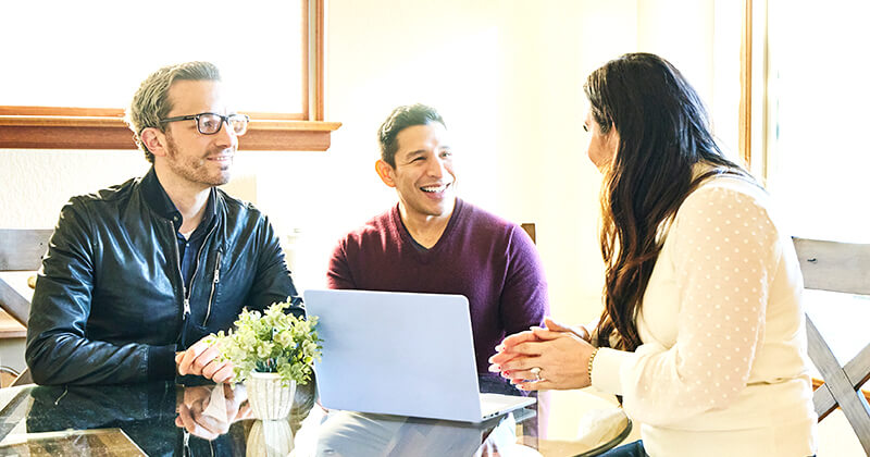 real estate agent meeting with couple