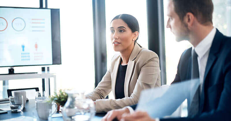 Businesspeople sitting in boardroom meeting