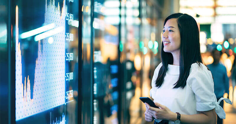 Confidence young businesswoman checking screen