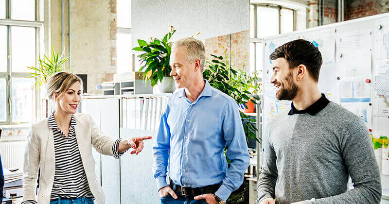 Small office team talking during morning