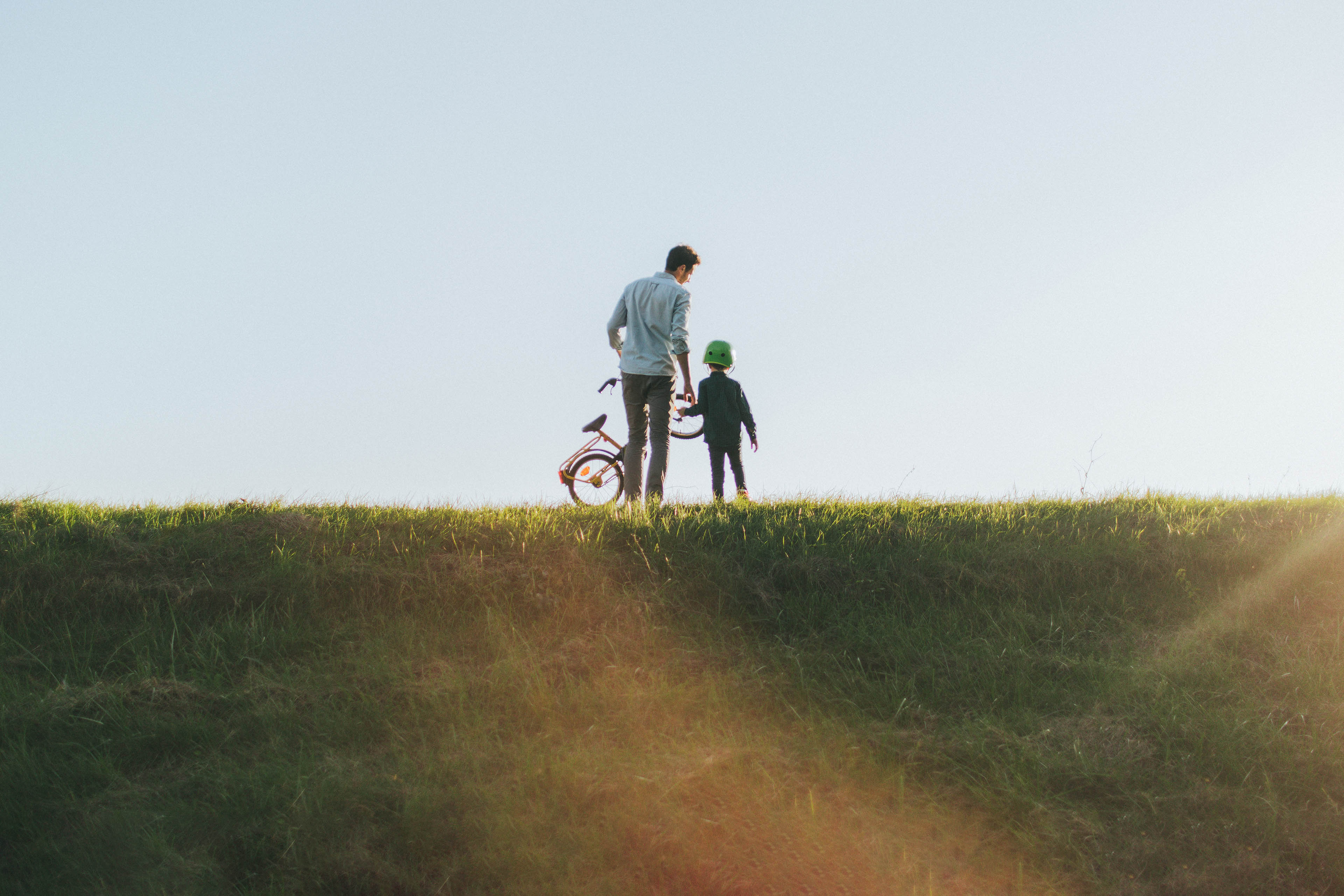 Father and son on a bicycle lane