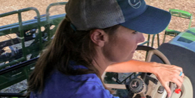 Woman driving a tractor