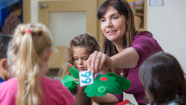 Teacher working with preschool students