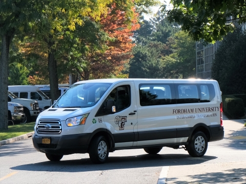 Ram van turning onto street on campus